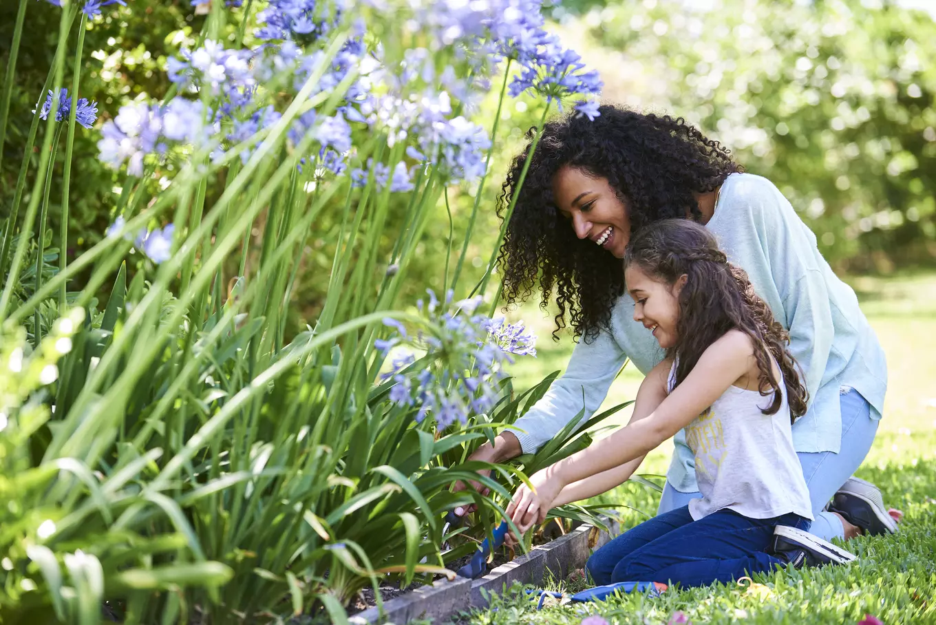 Woman and young girl gardening